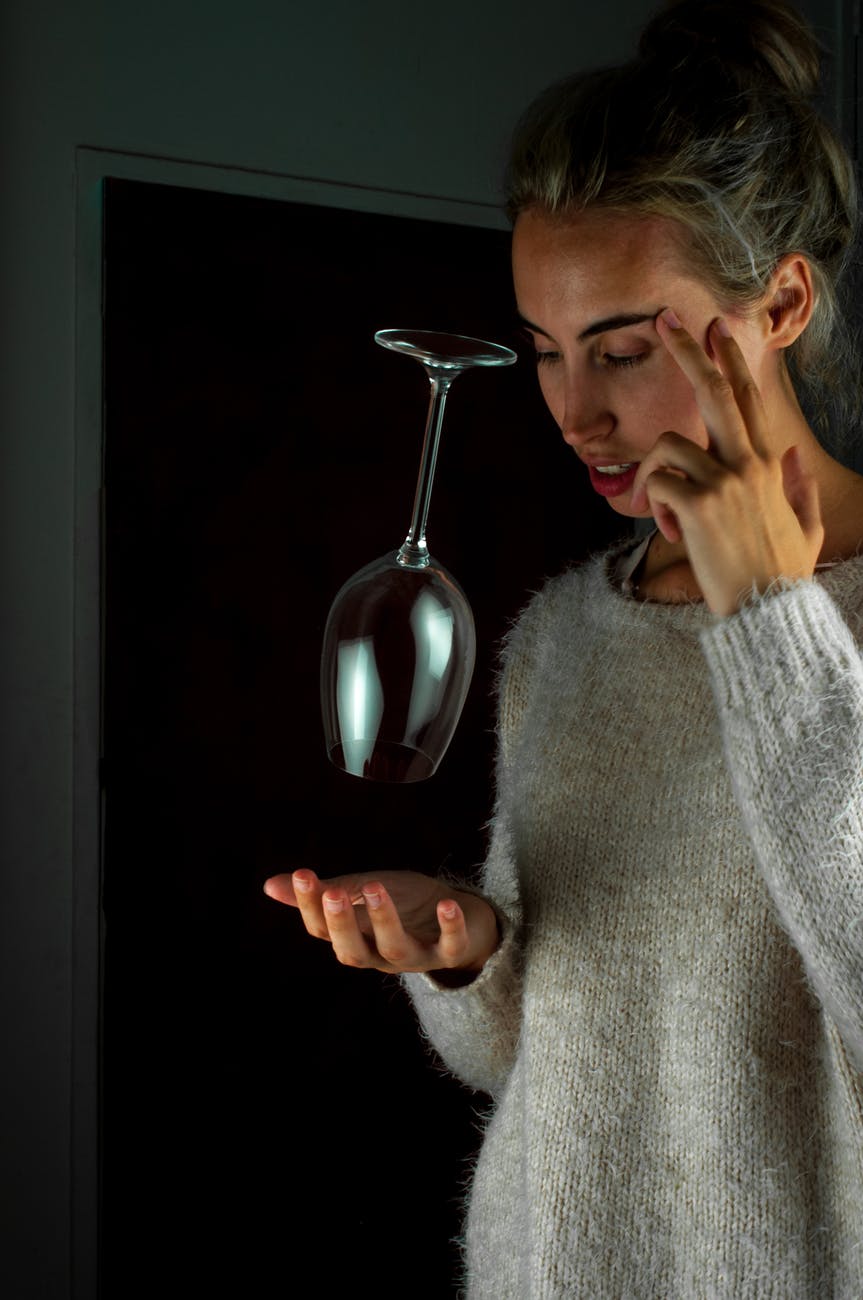 woman holding eye and concentrating
